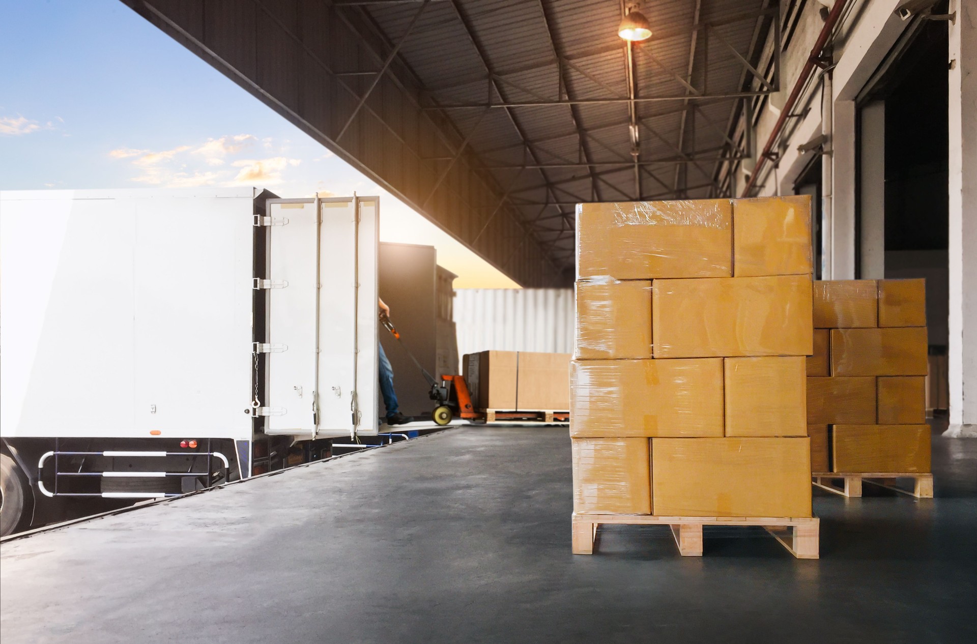 Package Boxes Wrapped Plastic Stacked on Pallets. Loading Goods into Container Trucks. Distribution Warehouse Shipping, Supply Chain Supplies, Shipment. Freight Truck Logistics Transportation.
